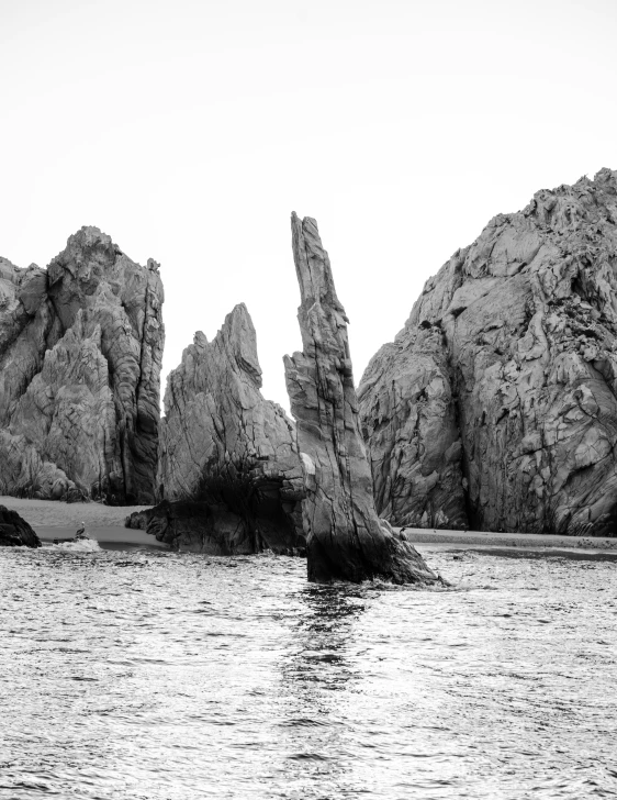 there are very large rock formations at the shoreline