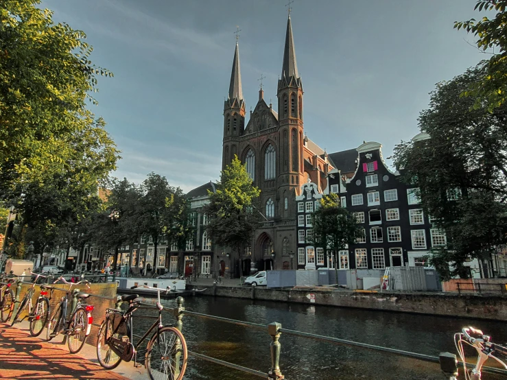 many bicycles are parked along the sides of the water