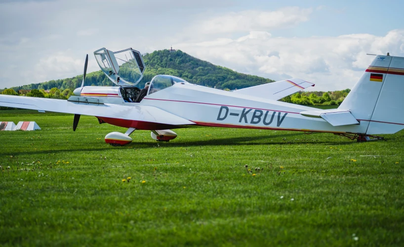 there is a small plane that has been left in the field