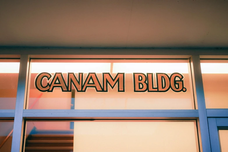 the window of a building with the name camam blgb