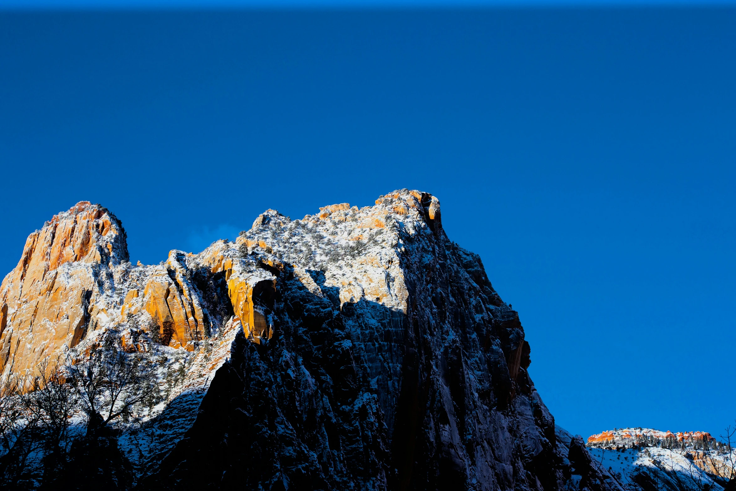 some mountains with very tall snow on them