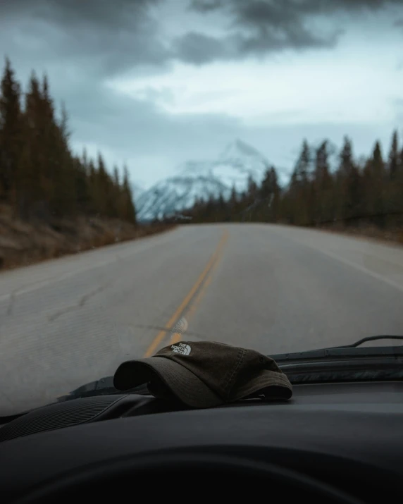 a view from the windshield of a car while driving on an open road