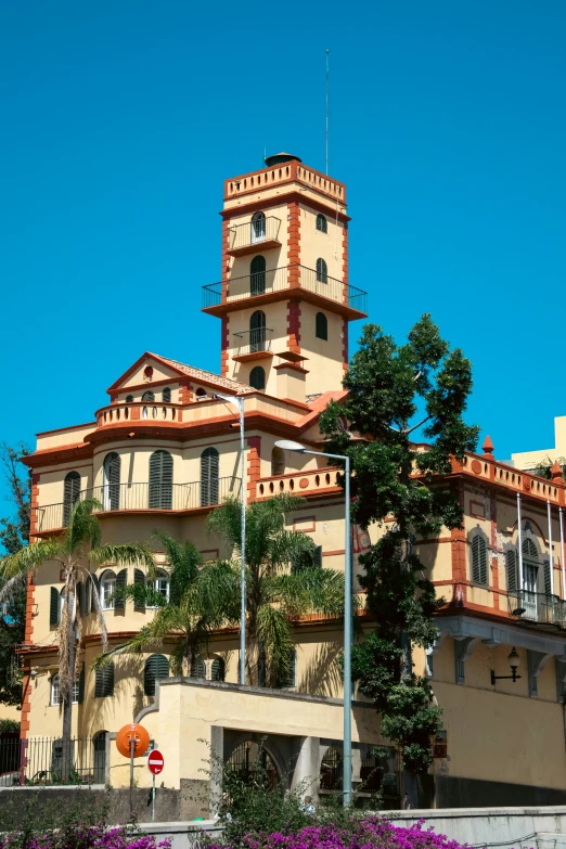 a big tower with some trees on top