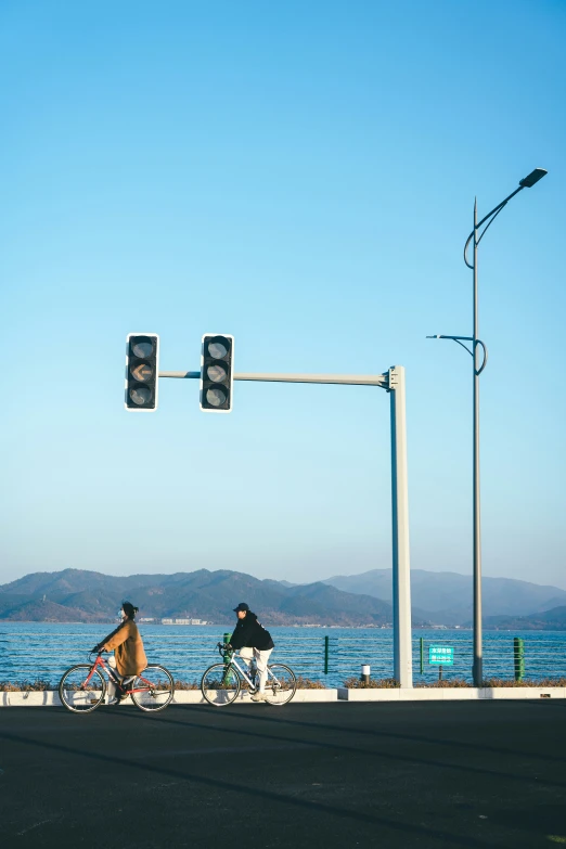 a man riding his bike by the side of the road