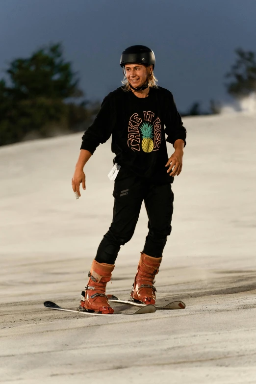 a man with long hair wearing skis and holding a pair of ski poles