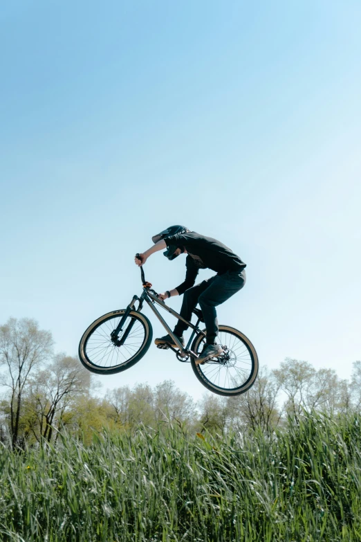 a person on a bike high in the air