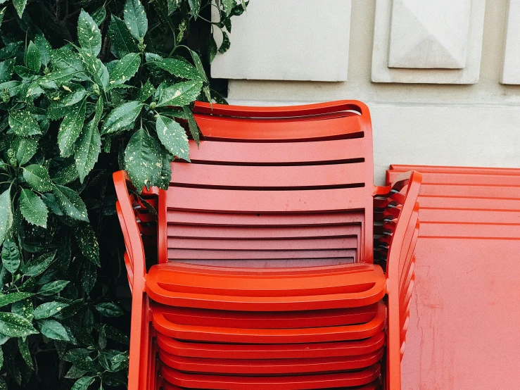 orange chairs near the corner of a building