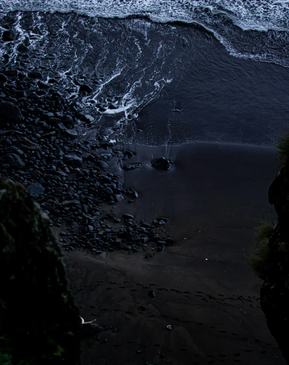 water is splashing on the shore of the beach