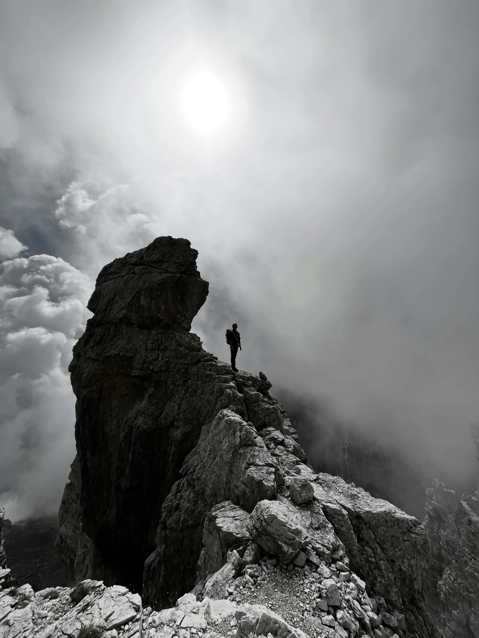 person standing on top of a rocky outcropping