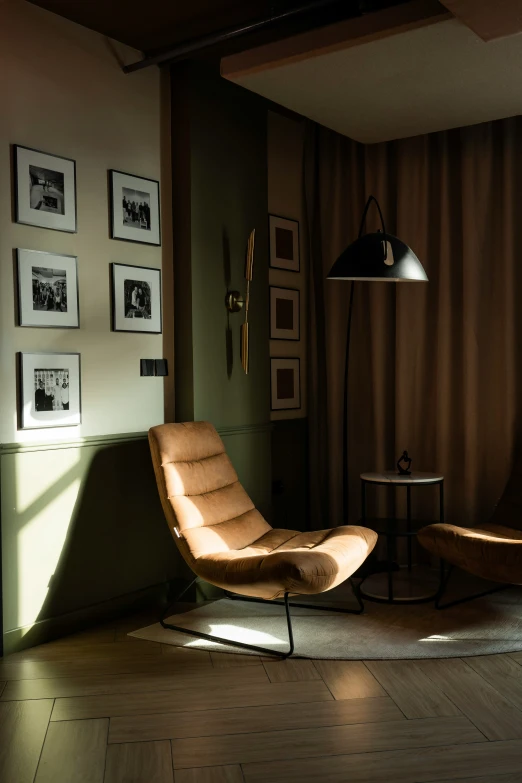 a chair and lamp are sitting in a corner