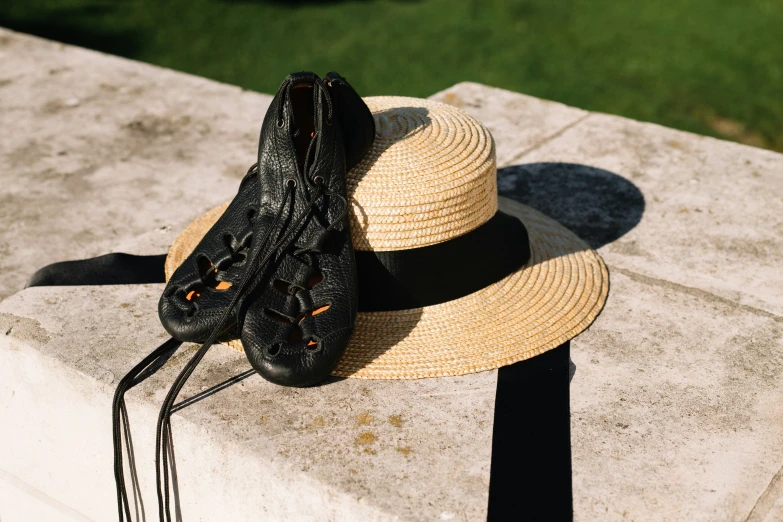 a hat, pair of shoes and a black string