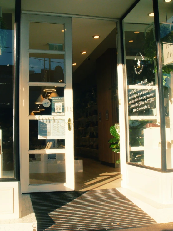 a door leading into a business with lots of windows