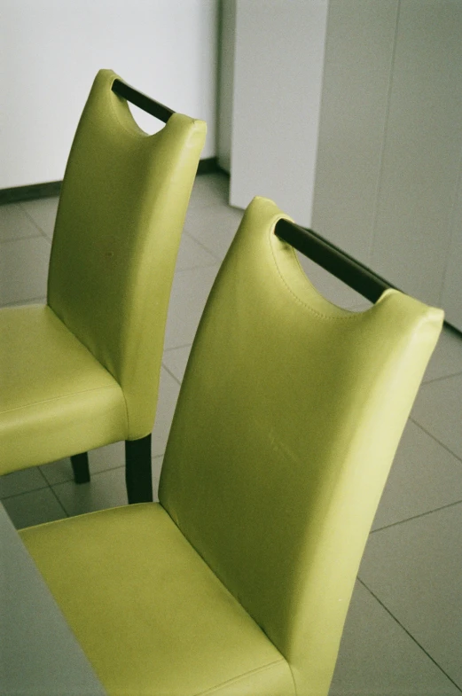 two chairs next to each other in a room