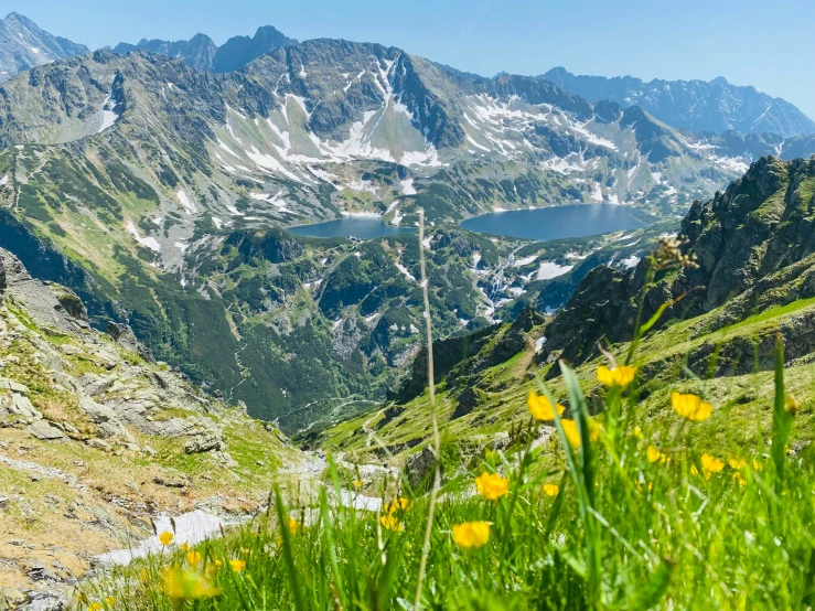 some mountains with small lakes are in the distance