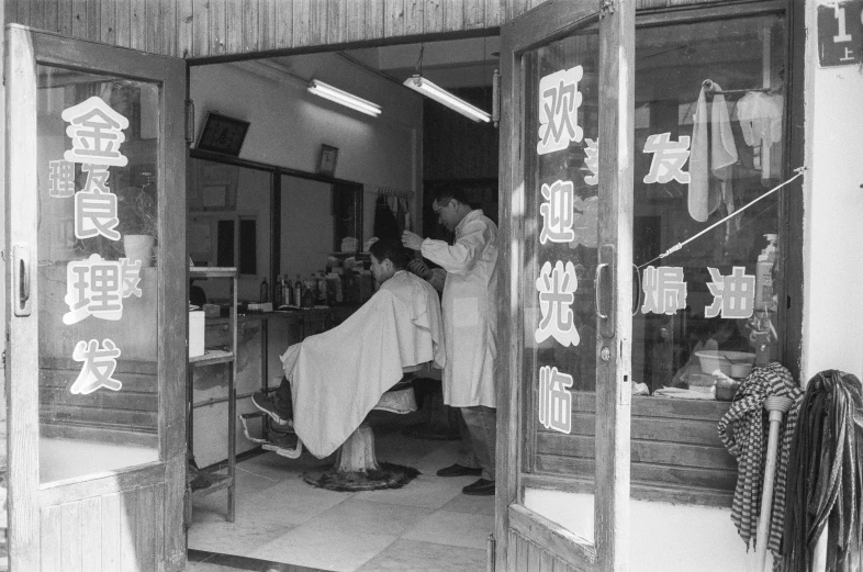 people sitting in the doorway to a building