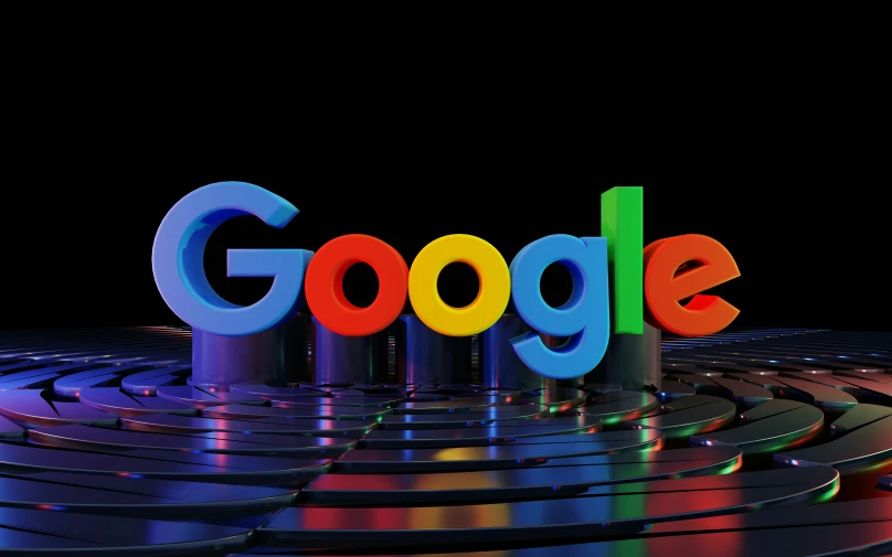 a bright colored google logo is in the center of rows of shiny metal ones