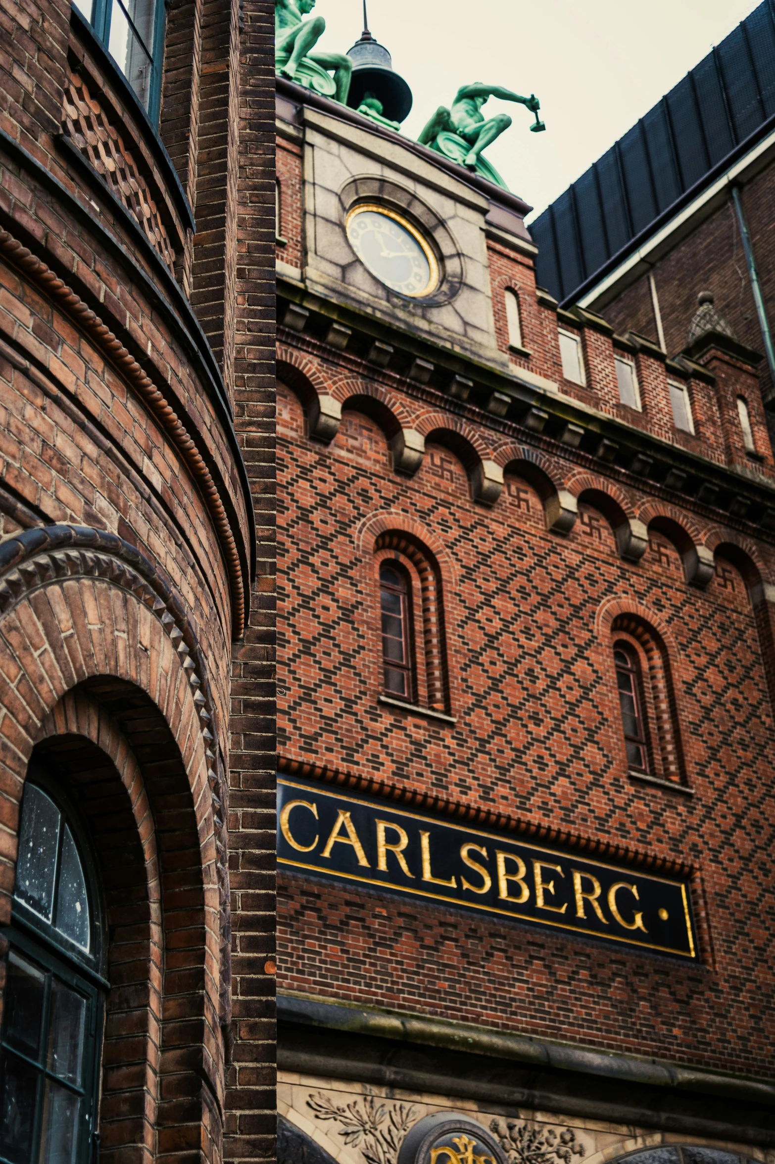 an old brick building is pictured on a cloudy day