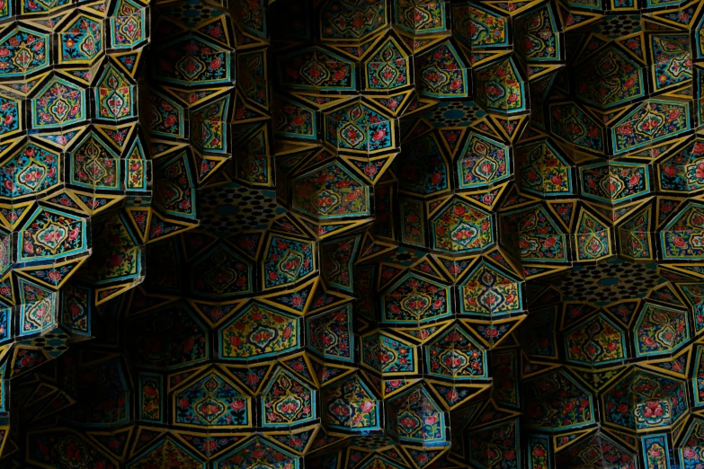intricate colorful pattern on an ornate wall of pottery