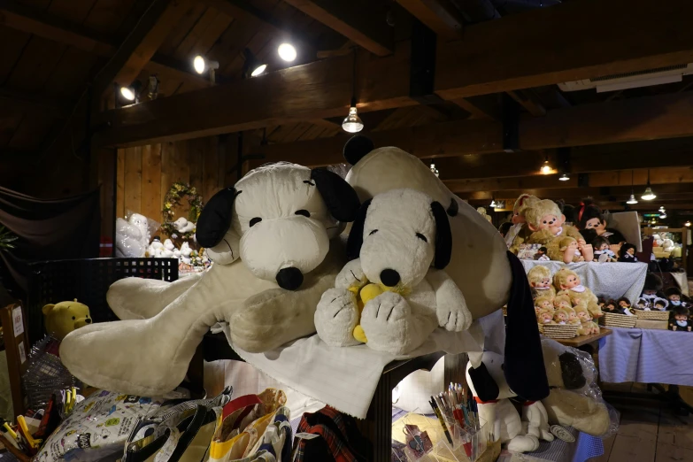 the stuffed animals are for sale in the market