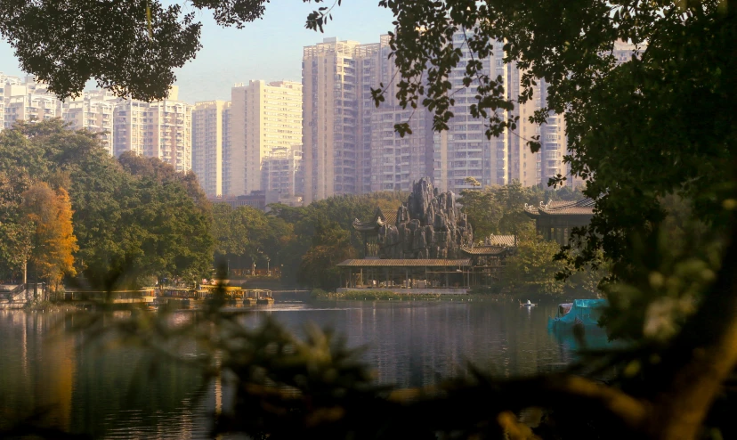 a city sits on a river in the distance