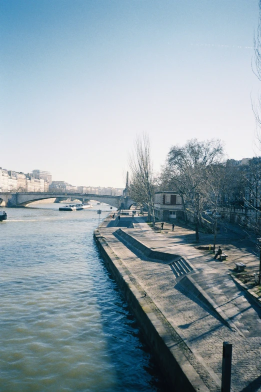 a wide waterway that is near some buildings