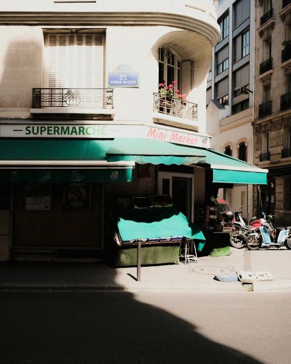 a cafe building is seen in this shadow