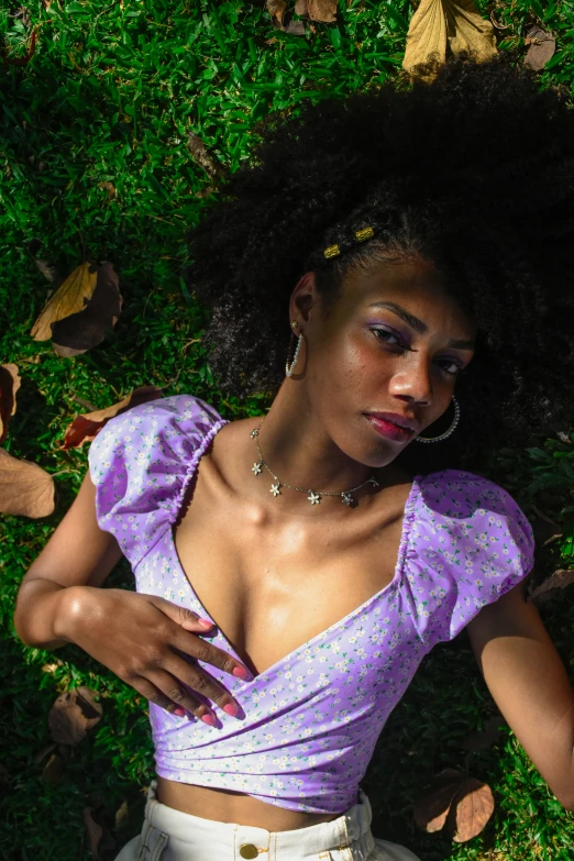 a close up of a person laying on grass