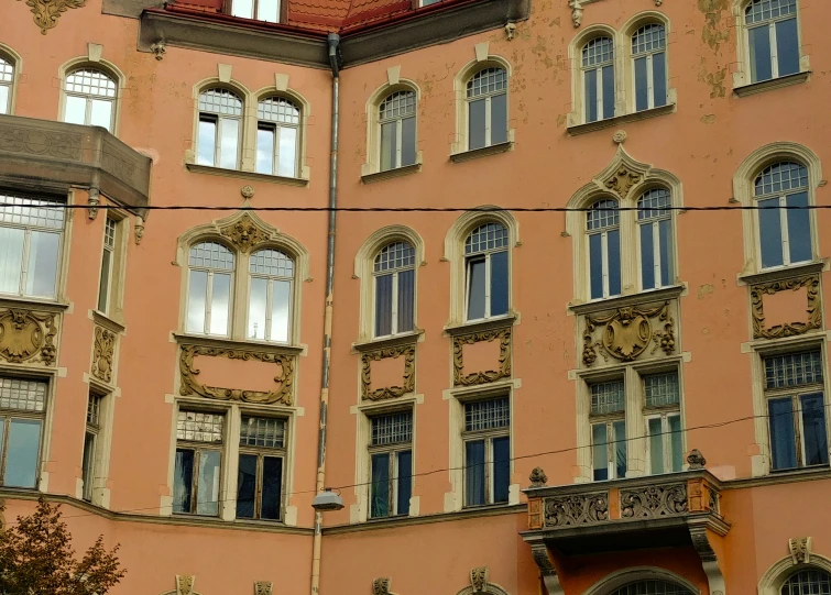 the windows on a big building look very old