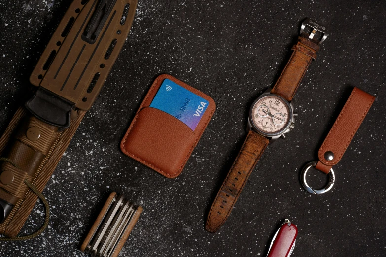 an assortment of wrist watches, razors, and a wallet