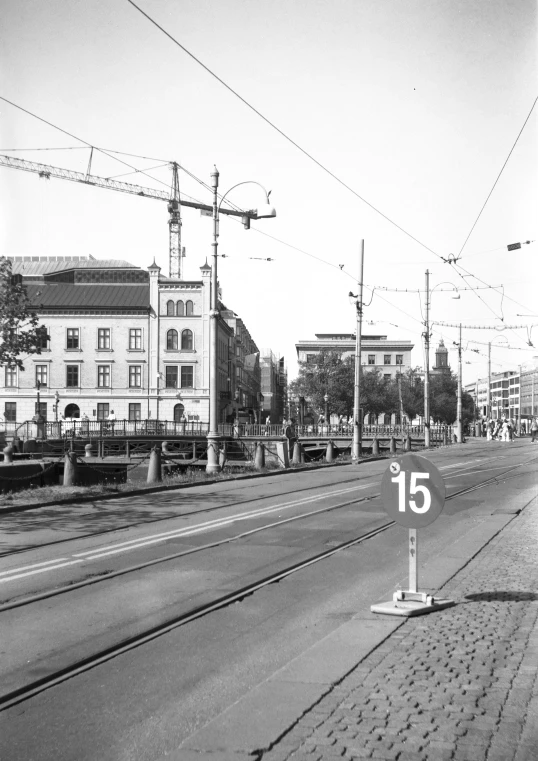 a train tracks and a street and buildings