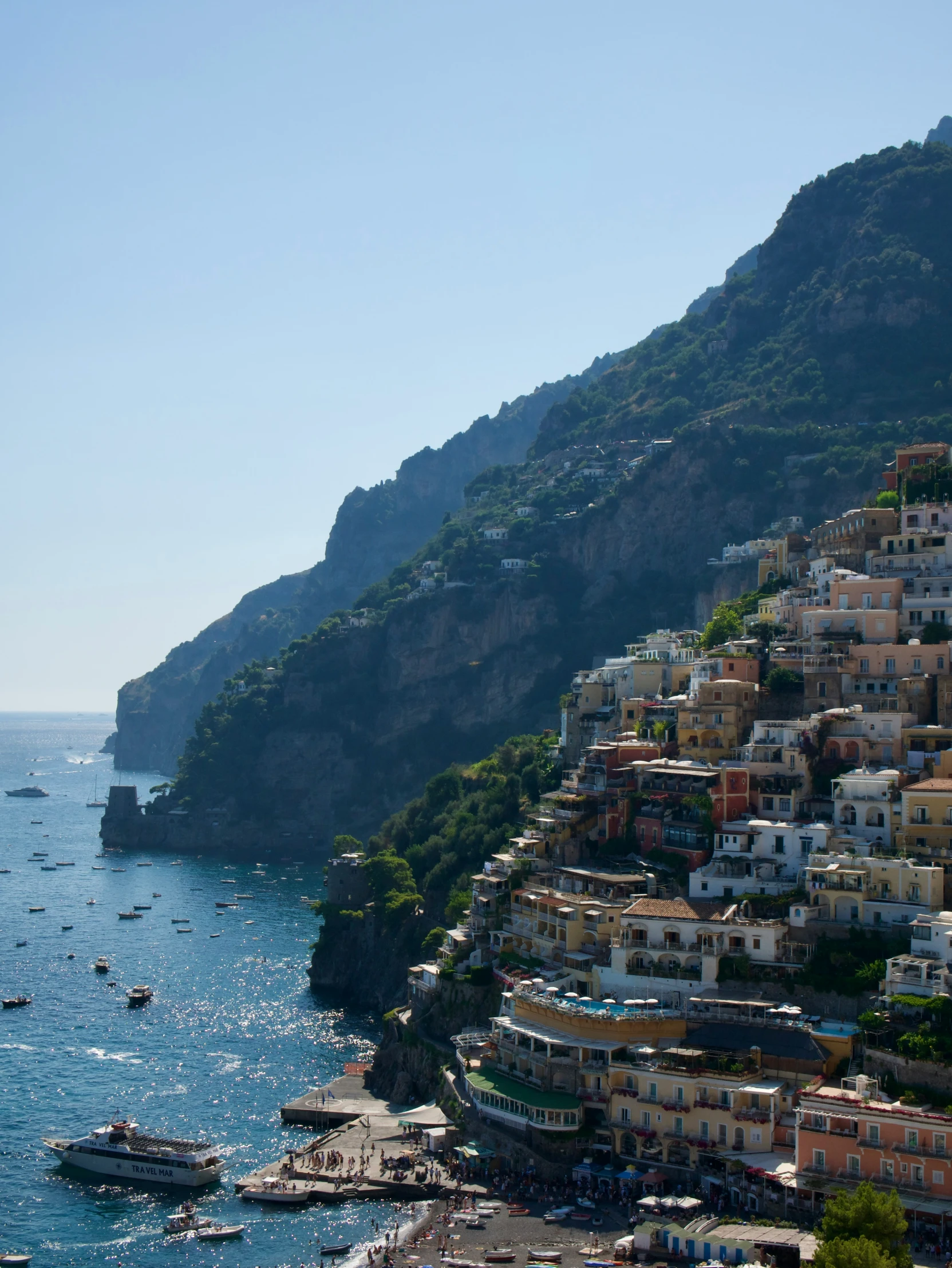 a view of some houses on a cliff near the ocean