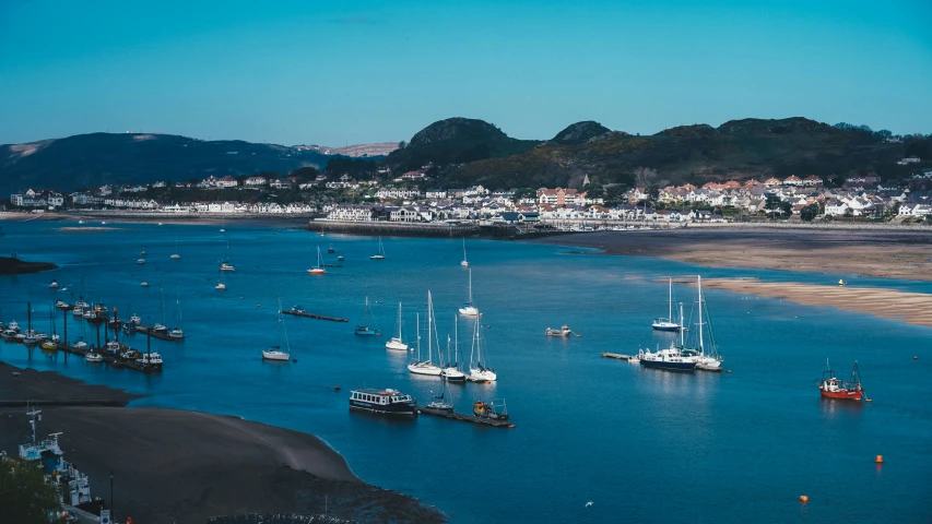 many boats are out on the water in a harbor