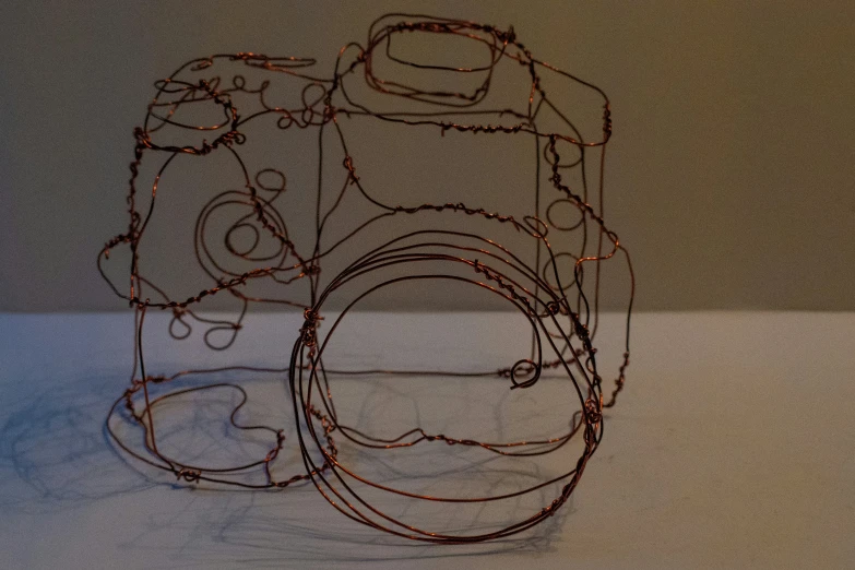 a wire sculpture of a camera