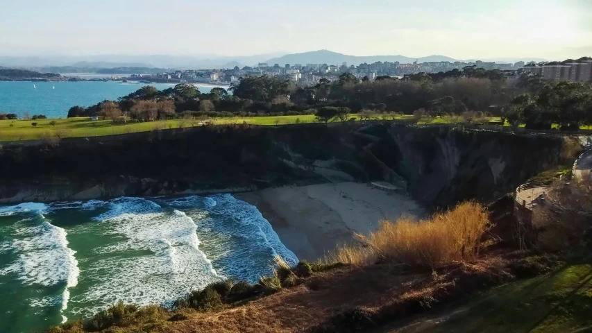 an aerial view of an island near a beach and ocean