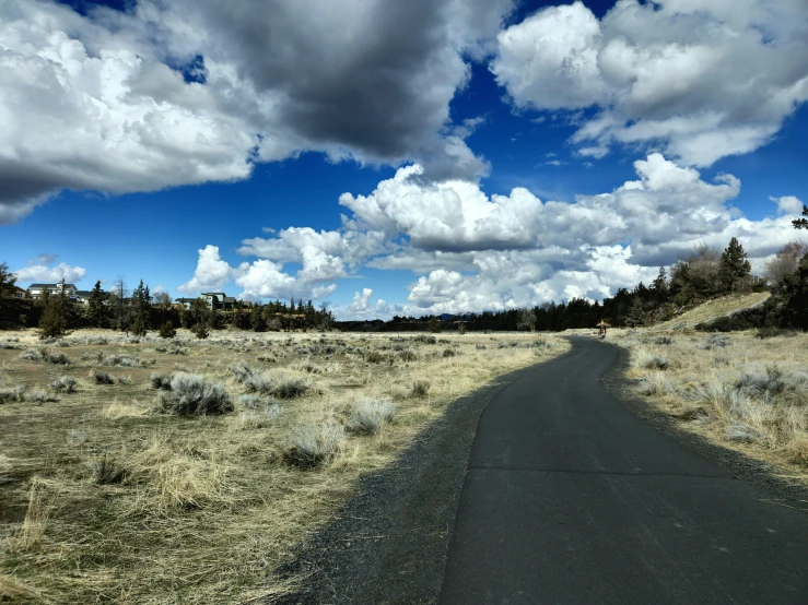 the asphalt road is wide enough for cars to pass