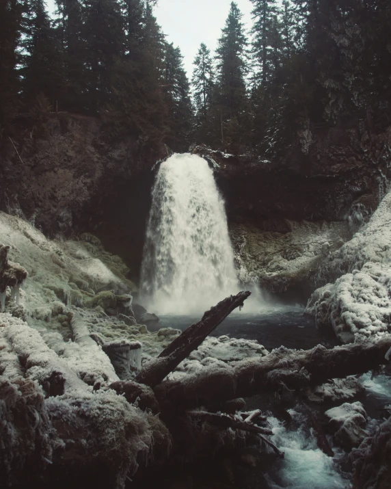 a very big pretty waterfall in the woods