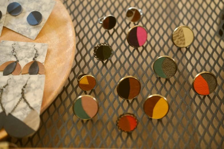 colorful earrings and earring sets in display on table