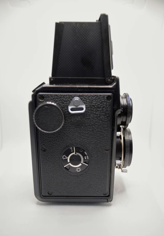 a vintage camera is sitting in a studio