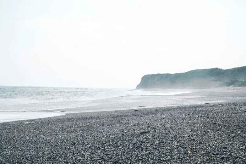 this is a po of the beach and cliffs that the ocean sits on