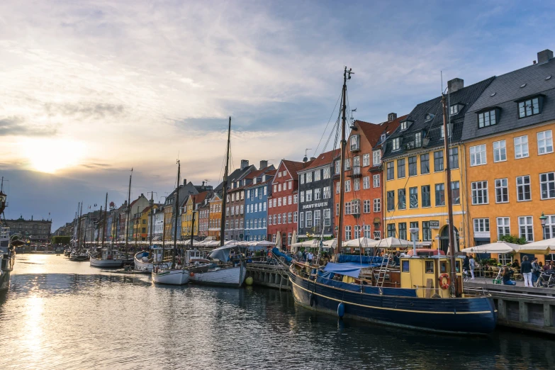 colorful houses line the waterfront in an old city