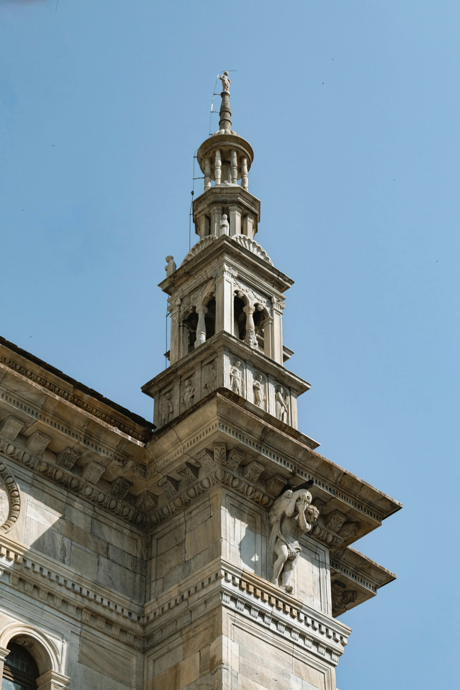 a very tall clock tower with a steeple top