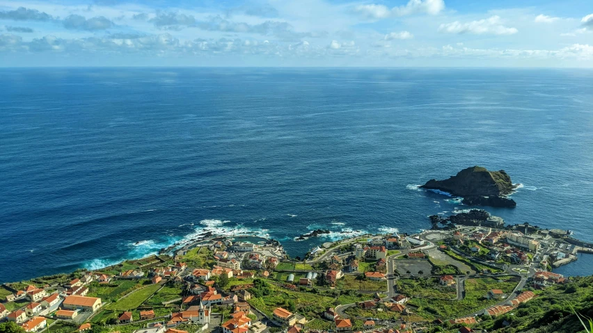 an aerial view of the ocean from a cliff