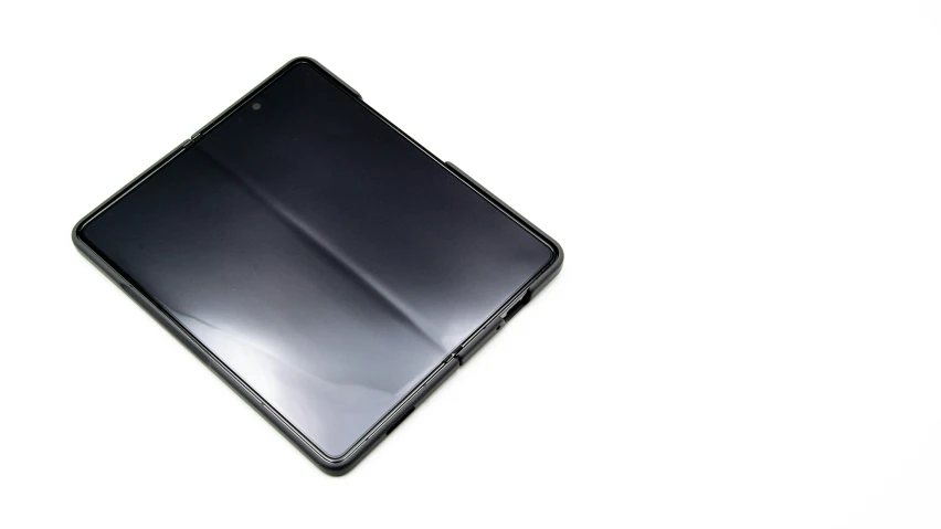 a black ipad sleeve is shown with a grey finish