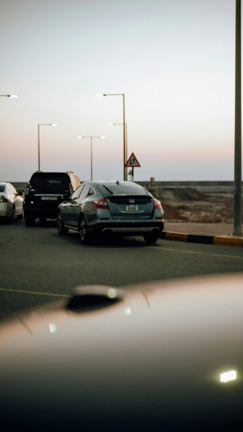 several cars in the parking lot at a station