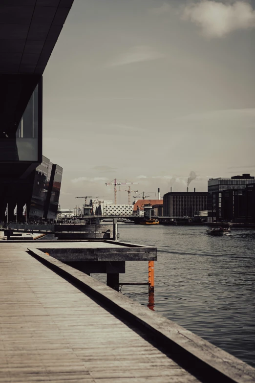 a dock on the water by a city