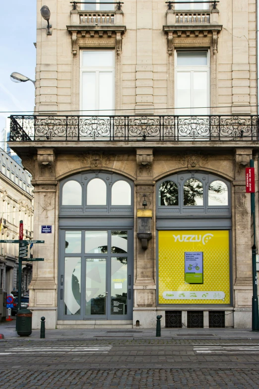 the front of a building has a few doors