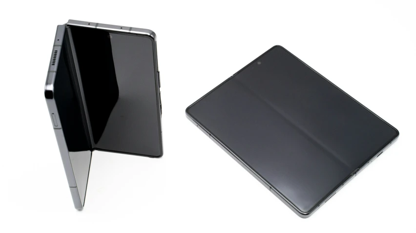 a tablet with a black cover and a white background