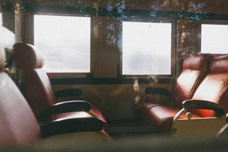 two chairs that are facing each other near one another