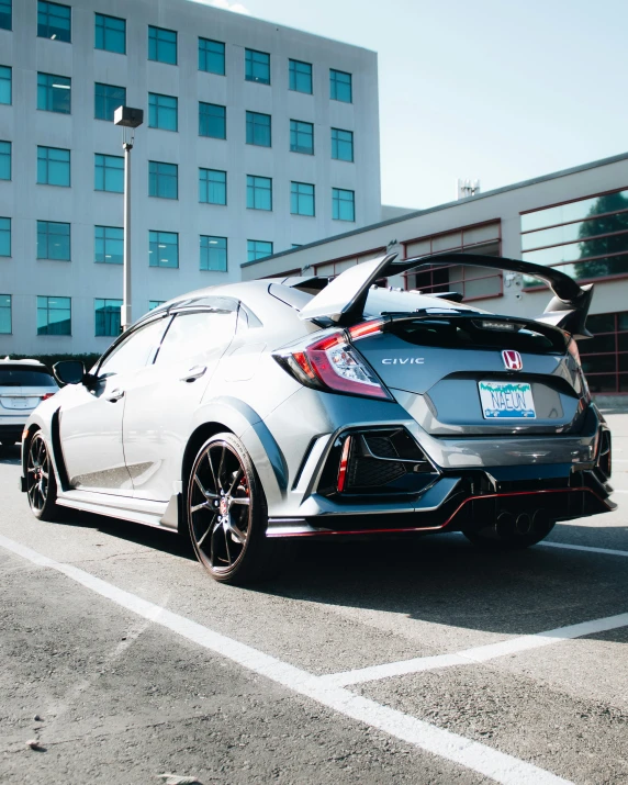 a very nice car parked next to a big building