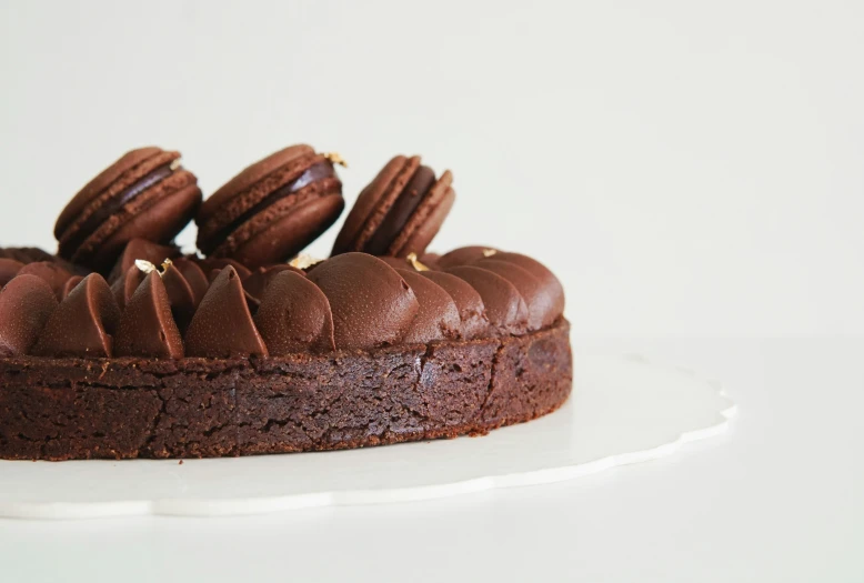 chocolate dessert with icing and pecans on top